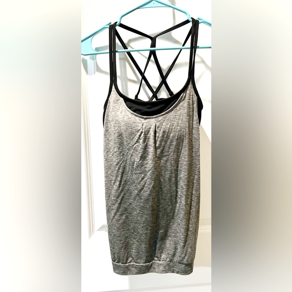 Athleta. Women’s breathable, open back, workout top. Barely worn. Like new.